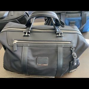 Tumi leather and canvas bag brand new, never used